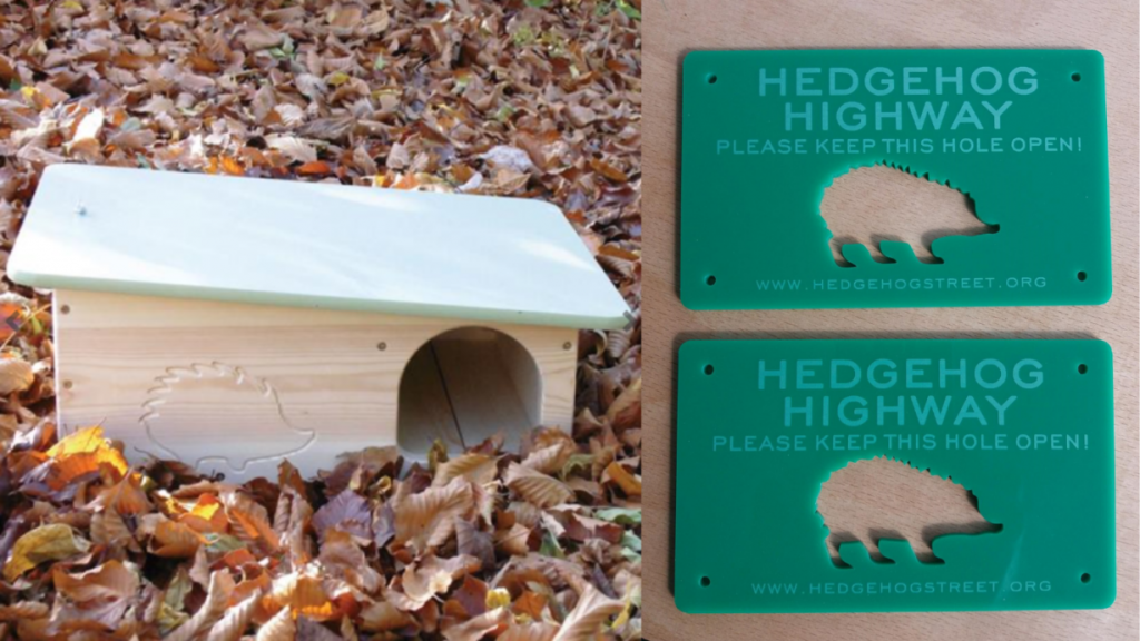 A hedgehog home and two hedgehog highway signs