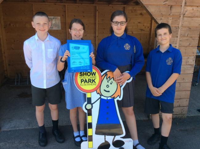 Exning Primary School Junior Road Safety Officers Carrick Needham, left, Eva Szkic, Annabelle James, and Troy Cole with the school’s Modeshift STARS award.