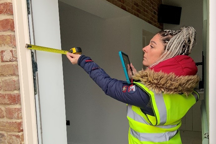 Sophia Gentile, a New Anglia LEP Skills Bootcamp graduate inspecting a home for retrofit