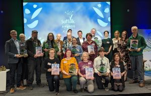 A image of the Greenest County Award winners on stage. 